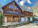 Gorgeous lakefront cabin with stone and wood exterior, three car garage and multiple decks at 720 Potneck Rd, Salisbury, NC 28147