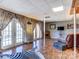 Finished basement with a fireplace, zebra rug, and French doors at 720 Potneck Rd, Salisbury, NC 28147