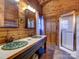 Bathroom with double sinks, unique decor and a glass shower at 720 Potneck Rd, Salisbury, NC 28147