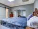 Bedroom with a sliding barn door, mirrored closet, and comfortable bed at 720 Potneck Rd, Salisbury, NC 28147