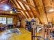 Bonus room with angled ceiling, wooden walls, wood floors, and a decorative zebra rug at 720 Potneck Rd, Salisbury, NC 28147