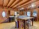 Open kitchen with wood cabinets, an island with seating, and decorative backsplash at 720 Potneck Rd, Salisbury, NC 28147