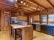 Well-equipped kitchen with stainless steel refrigerator and a center island with tile countertop at 720 Potneck Rd, Salisbury, NC 28147
