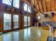 Bright living area with floor-to-ceiling windows, wooden ceiling, and beautiful outdoor views at 720 Potneck Rd, Salisbury, NC 28147