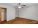 Bedroom with hardwood floors, closet, and ceiling fan offers a simple, comfortable space at 807 Claremont Rd, Charlotte, NC 28214