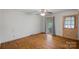 Bedroom featuring original hardwood floors, natural light, a ceiling fan, and classic charm at 807 Claremont Rd, Charlotte, NC 28214