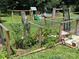 Spacious backyard featuring a garden, playset, and swing set for outdoor fun at 8122 Hutchison Ln, Vale, NC 28168