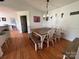 A dining room features a rustic wooden table with white chairs and benches at 8122 Hutchison Ln, Vale, NC 28168