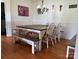 The dining room shows a large wooden table surrounded by chairs and benches at 8122 Hutchison Ln, Vale, NC 28168