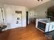 Open-concept kitchen and dining area with modern finishes, perfect for Gathering gatherings and entertaining at 8122 Hutchison Ln, Vale, NC 28168
