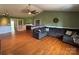A spacious living room with a fireplace, hardwood floors, and cozy seating at 8122 Hutchison Ln, Vale, NC 28168