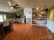An open living area showcasing hardwood floors and seamless flow throughout the home at 8122 Hutchison Ln, Vale, NC 28168