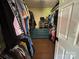 Spacious walk-in closet with built-in shelving, drawers, and ample hanging space for clothes and accessories at 8122 Hutchison Ln, Vale, NC 28168