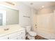 Clean bathroom with tub/shower combo, vanity, and wood-look floors at 9000 Vagabond Rd, Charlotte, NC 28227