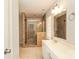 Bathroom featuring glass shower, vanity, and neutral wall and floor tile at 9000 Vagabond Rd, Charlotte, NC 28227