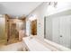 Bathroom with glass shower, double sink vanity, and recessed lighting at 9000 Vagabond Rd, Charlotte, NC 28227