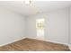 Bright bedroom features wood-look floors and a window letting in plenty of natural light at 9000 Vagabond Rd, Charlotte, NC 28227