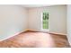 Bedroom features hardwood floors and natural light from a large window at 9000 Vagabond Rd, Charlotte, NC 28227