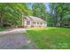 Charming home with a well-manicured lawn and classic design at 9000 Vagabond Rd, Charlotte, NC 28227