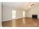 Spacious living room featuring vaulted ceilings, a cozy fireplace, and abundant natural light at 9000 Vagabond Rd, Charlotte, NC 28227