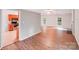 Open floor plan featuring a light-filled living room with an archway into the kitchen at 9000 Vagabond Rd, Charlotte, NC 28227
