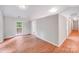 Living room with wood-look floors and a view to the backyard at 9000 Vagabond Rd, Charlotte, NC 28227