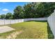 Expansive backyard enclosed by a white fence, providing a secure and private outdoor area at 9511 Turning Wheel Dr, Charlotte, NC 28214