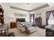 Bedroom with decorative tray ceiling and a comfortable seating area at 9511 Turning Wheel Dr, Charlotte, NC 28214