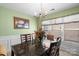 Bright dining room with a marble table, decorative centerpiece, and large window at 9511 Turning Wheel Dr, Charlotte, NC 28214