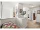 Bright hallway with neutral carpeting and charming decorative wall art at 9511 Turning Wheel Dr, Charlotte, NC 28214