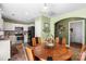 Inviting kitchen with white cabinets, stainless steel appliances, and a cozy breakfast nook at 9511 Turning Wheel Dr, Charlotte, NC 28214