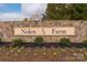 Stone community sign with flowerbeds, highlighting the Nolen Farm community at 9529 Cotswood Pl, Gastonia, NC 28056