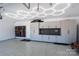 Organized garage featuring epoxy floors, custom cabinetry, a slat wall and unique lighting at 9529 Cotswood Pl, Gastonia, NC 28056