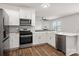 Bright kitchen features stainless steel appliances, white cabinets, and a functional layout at 9529 Cotswood Pl, Gastonia, NC 28056
