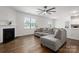 Bright living room with hardwood floors, a fireplace, and an open view into the kitchen area at 9529 Cotswood Pl, Gastonia, NC 28056