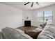 Inviting living room with fireplace, hardwood floors, a ceiling fan, and comfortable seating at 9529 Cotswood Pl, Gastonia, NC 28056