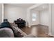 Open-concept living space with hardwood floors, a modern piano, and bright natural light at 9529 Cotswood Pl, Gastonia, NC 28056