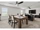 An open living room features a billiards table, a comfortable seating area, and a large entertainment center at 9529 Cotswood Pl, Gastonia, NC 28056