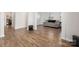 Expansive living room featuring beautiful floors, natural light, and a convenient laundry area at 9529 Cotswood Pl, Gastonia, NC 28056