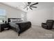 Spacious main bedroom featuring a ceiling fan, and a nightstand at 9529 Cotswood Pl, Gastonia, NC 28056