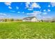 Spacious backyard with lush green lawn and views of neighboring properties at 103 Chambwood Ln, Shelby, NC 28152