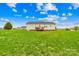 Large backyard with lush green grass and cozy wooden deck at 103 Chambwood Ln, Shelby, NC 28152