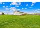 Expansive backyard with lush lawn and wooden deck, perfect for outdoor entertaining at 103 Chambwood Ln, Shelby, NC 28152
