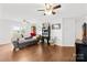 Cozy living room with hardwood floors, ceiling fans, and comfortable seating at 103 Chambwood Ln, Shelby, NC 28152