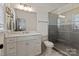 Modern bathroom featuring a glass-enclosed shower, marble countertop, and sleek fixtures at 11008 Strike The Gold Ln, Waxhaw, NC 28173