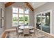 Bright dining room featuring a decorative chandelier and outdoor views of the pool and backyard at 11008 Strike The Gold Ln, Waxhaw, NC 28173