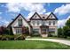 Stunning two-story brick home featuring a well-manicured front yard and a classic architectural design at 11008 Strike The Gold Ln, Waxhaw, NC 28173