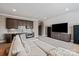 Spacious living room featuring a wet bar, entertainment center, and a comfortable sectional sofa at 11008 Strike The Gold Ln, Waxhaw, NC 28173