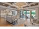 Open-concept living room with a view of the kitchen, patio, and backyard at 11008 Strike The Gold Ln, Waxhaw, NC 28173