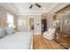 Comfortable main bedroom shows a tray ceiling, hardwood floors, and neutral colored walls at 11008 Strike The Gold Ln, Waxhaw, NC 28173